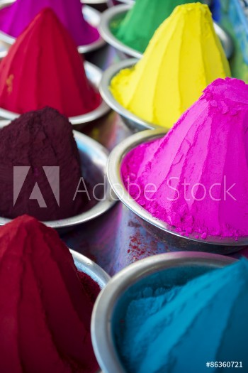 Picture of Colorful piles of Indian bindi powder dye at outdoor local Devaraja Market in Mysore India blue yellow red green pink and purple